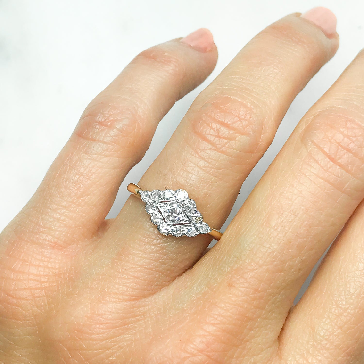 Florrie early 20th century diamond cluster engagement ring