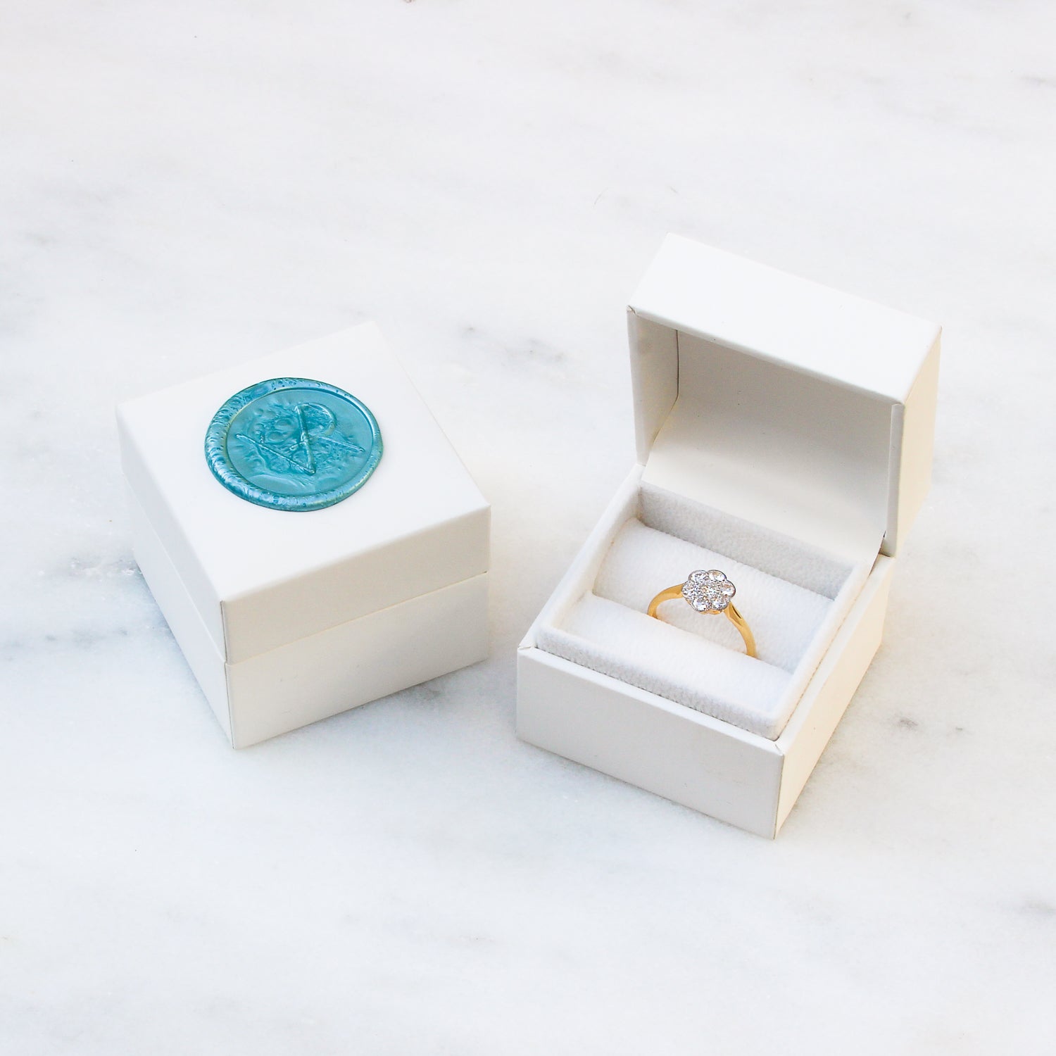 Kitty emerald and diamond engagement ring