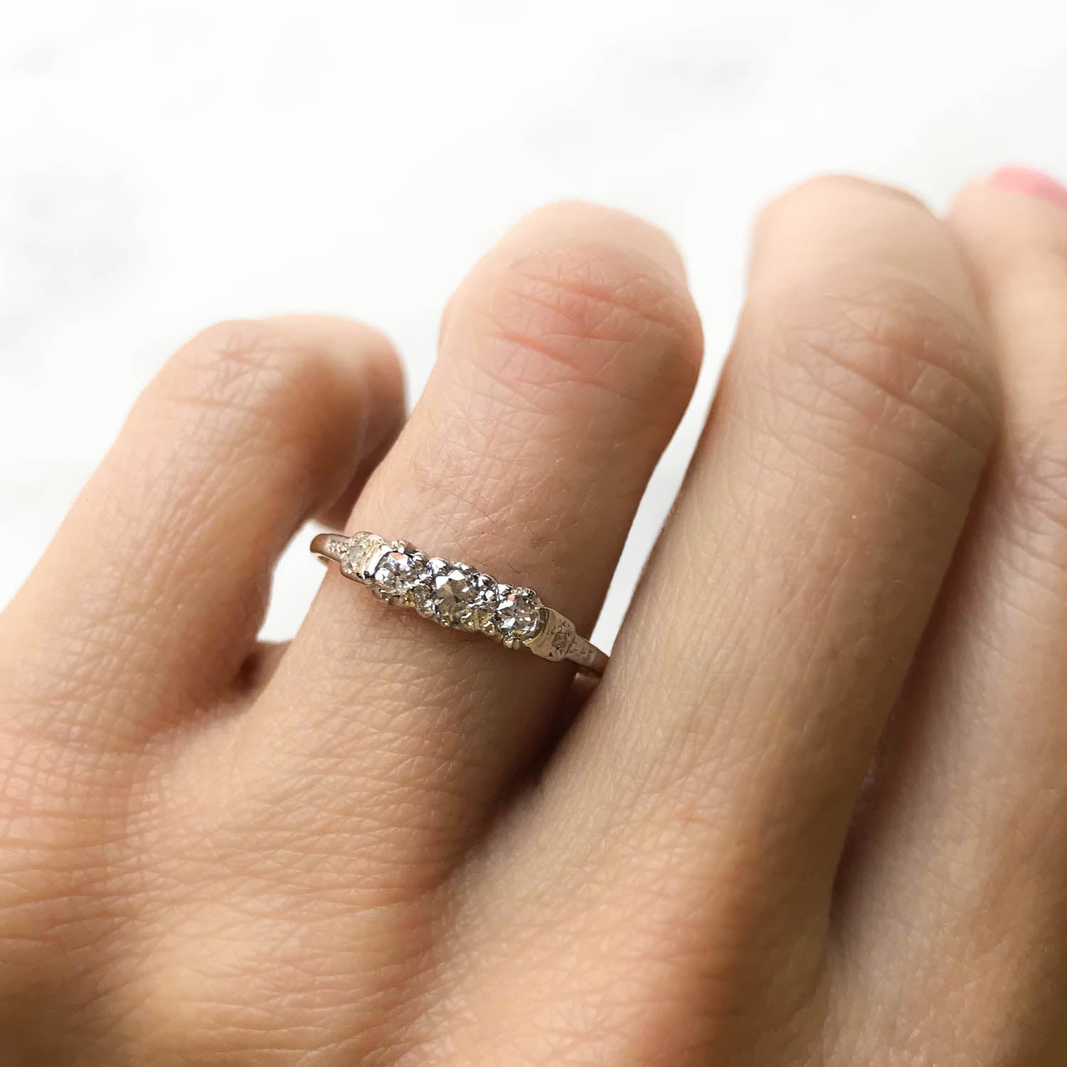 Dorothy three stone diamond mid-century engagement ring