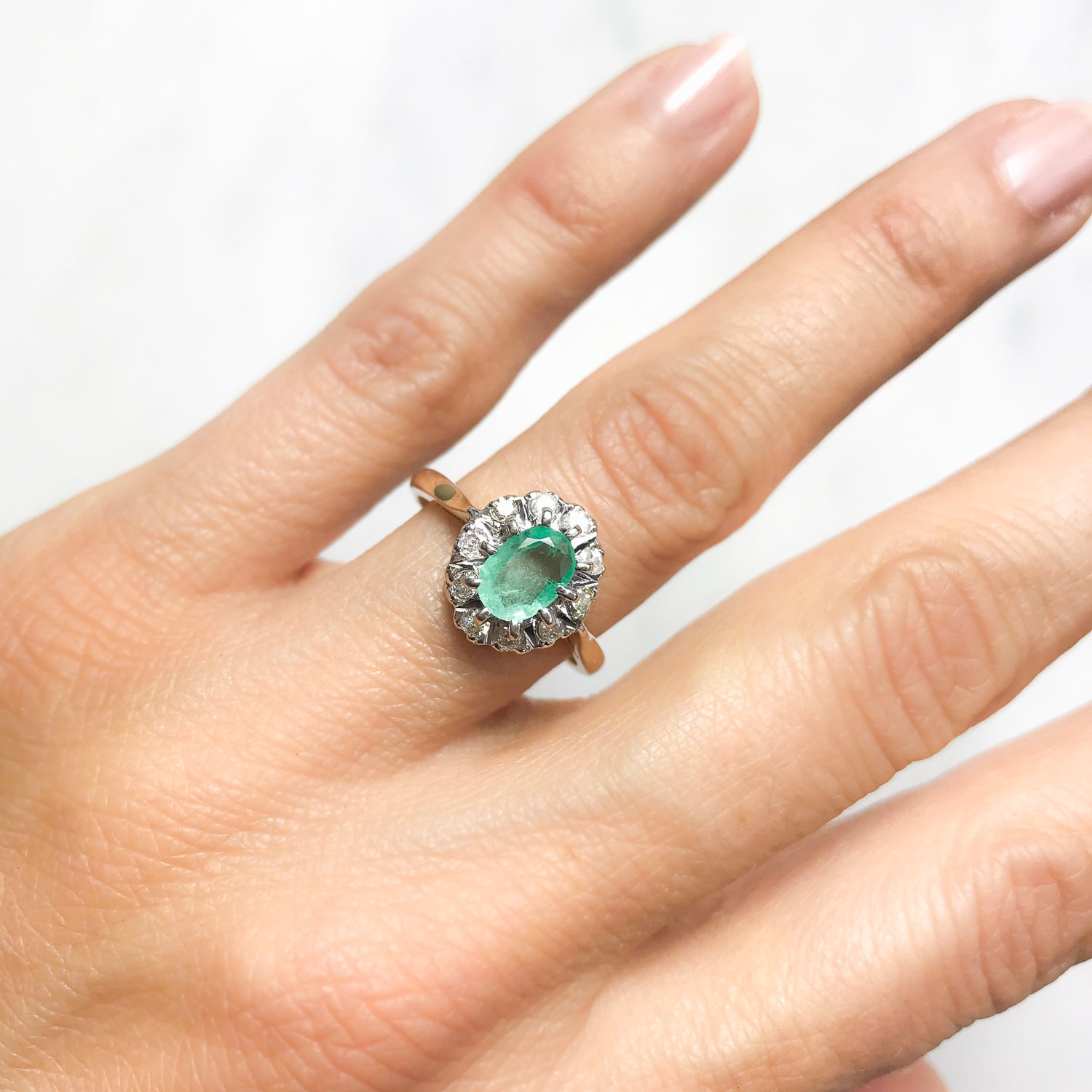 Kitty emerald and diamond engagement ring