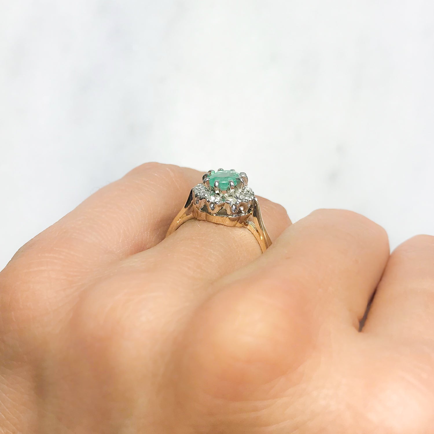 Kitty emerald and diamond engagement ring