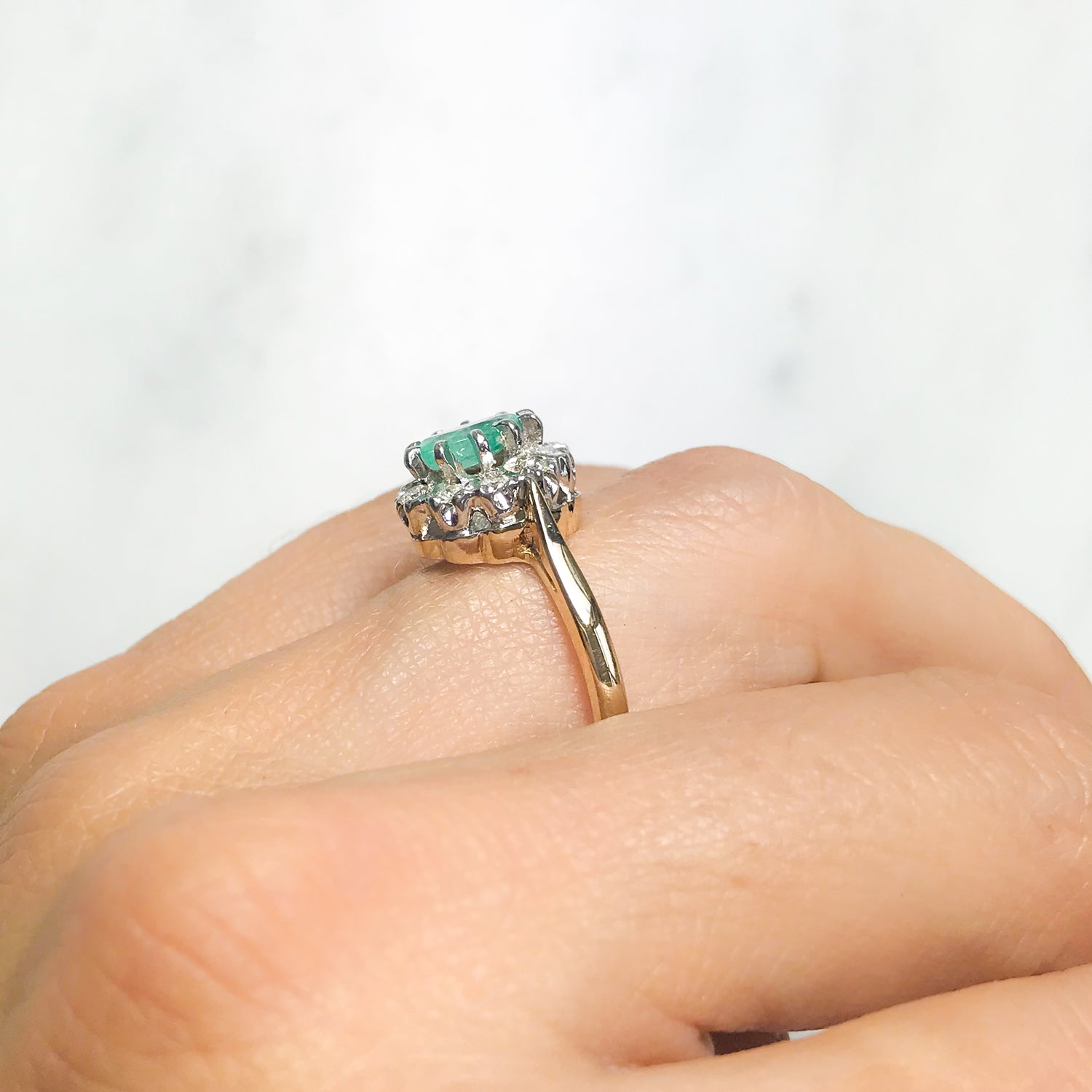 Kitty emerald and diamond engagement ring